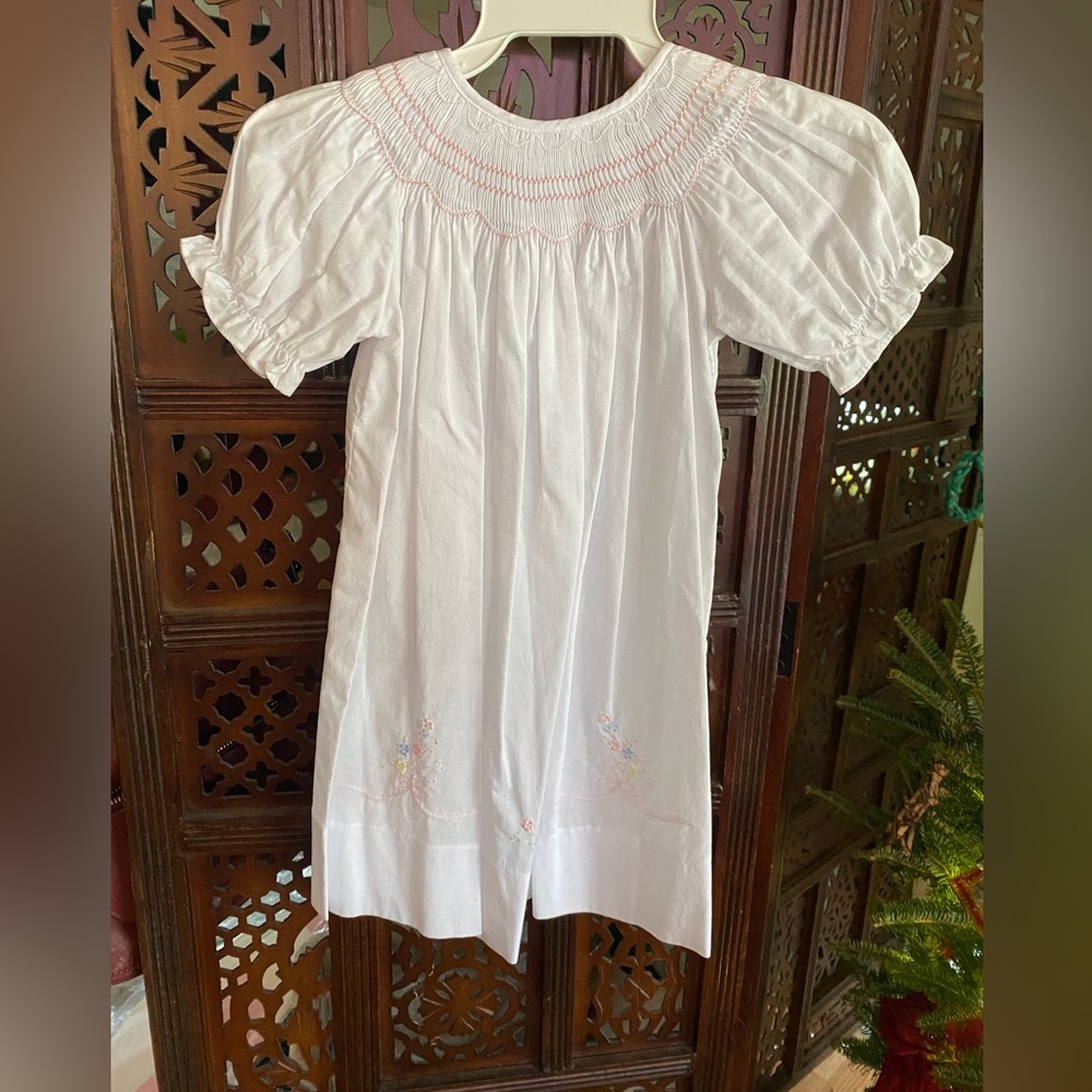 Worn once. White embroidered smock with flowers.